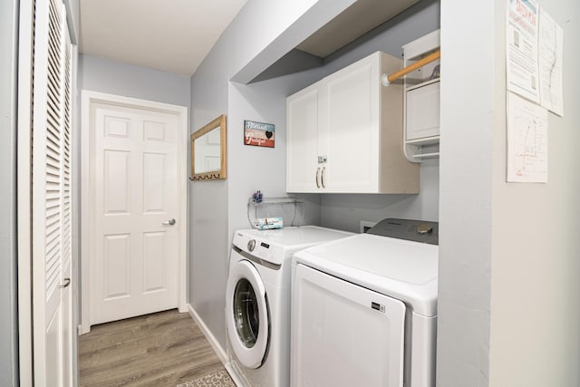 320 Turnberry Rd # 2, Branson, MO 65616 - washroom with cabinet space, independent washer and dryer, and light wood-type flooring