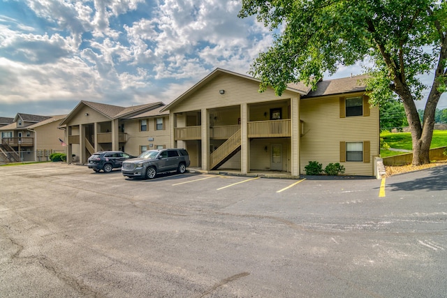 320 Turnberry Rd # 2, Branson, MO 65616 - view of property featuring stairway, uncovered parking, and a residential view