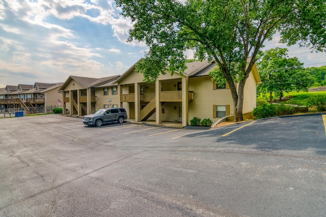 320 Turnberry Rd # 2, Branson, MO 65616 - view of property with stairway and uncovered parking