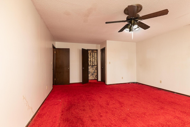 2311 E Meadow Dr, Springfield, MO 65804 - unfurnished bedroom featuring carpet flooring, a textured ceiling, and ceiling fan