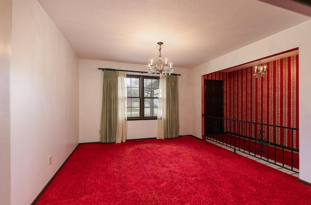 2311 E Meadow Dr, Springfield, MO 65804 - spare room with a chandelier, carpet flooring, and a textured ceiling