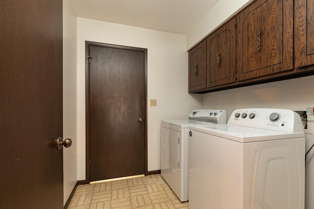 2311 E Meadow Dr, Springfield, MO 65804 - washroom with brick patterned flooring, cabinet space, and washing machine and clothes dryer