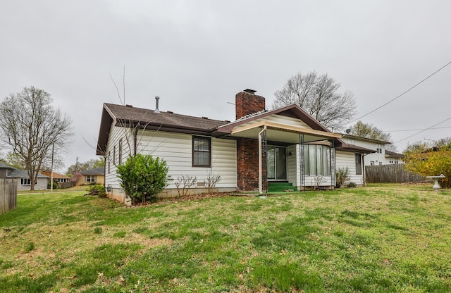 2311 E Meadow Dr, Springfield, MO 65804 - rear view of property featuring a chimney