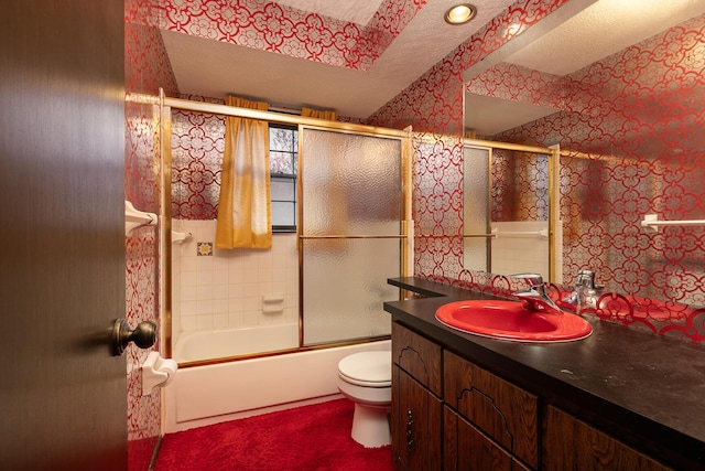 2311 E Meadow Dr, Springfield, MO 65804 - bathroom featuring vanity, bath / shower combo with glass door, and a textured ceiling