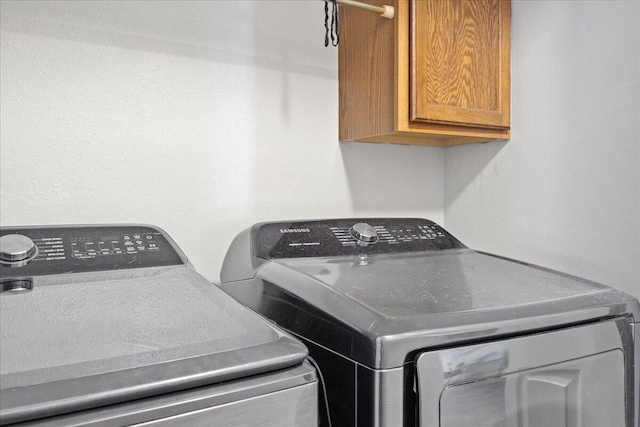 759 S Troy Ave, Springfield, MO 65802 - laundry area featuring cabinet space and washer and clothes dryer
