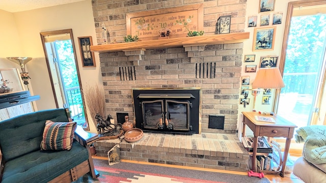 2930 S 175th Rd, El Dorado Springs, MO 64744 - living area featuring a fireplace and healthy amount of natural light