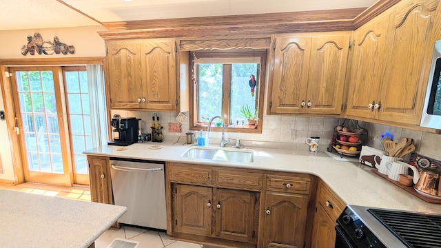 2930 S 175th Rd, El Dorado Springs, MO 64744 - kitchen featuring dishwasher, stove, light countertops, tasteful backsplash, and light tile patterned floors