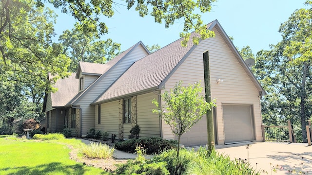 2930 S 175th Rd, El Dorado Springs, MO 64744 - view of side of property with concrete driveway, roof with shingles, an attached garage, and a yard