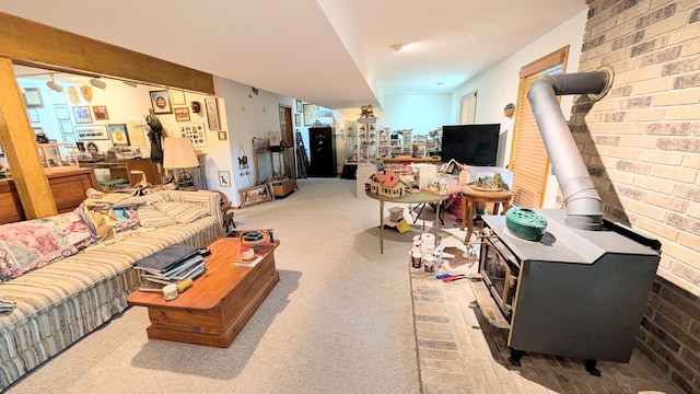 2930 S 175th Rd, El Dorado Springs, MO 64744 - carpeted living area featuring a wood stove