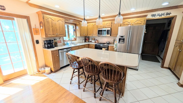 2930 S 175th Rd, El Dorado Springs, MO 64744 - kitchen featuring stainless steel appliances, light countertops, recessed lighting, tasteful backsplash, and a breakfast bar