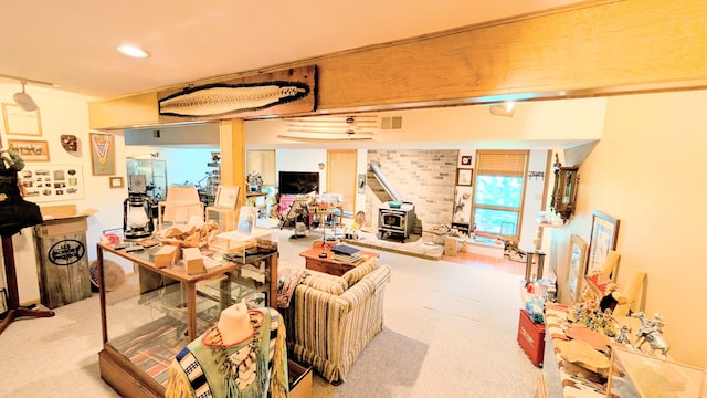 2930 S 175th Rd, El Dorado Springs, MO 64744 - basement featuring a wood stove, recessed lighting, and carpet floors