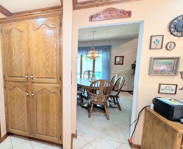 2930 S 175th Rd, El Dorado Springs, MO 64744 - dining room with a chandelier, light tile patterned floors, and light colored carpet