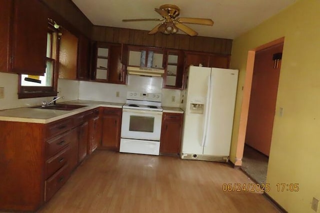321 W Cofield St, Aurora, MO 65605 - kitchen with white appliances, light countertops, light wood-style flooring, ceiling fan, and under cabinet range hood
