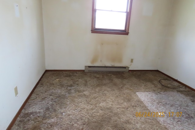 321 W Cofield St, Aurora, MO 65605 - carpeted spare room with a baseboard radiator and baseboards
