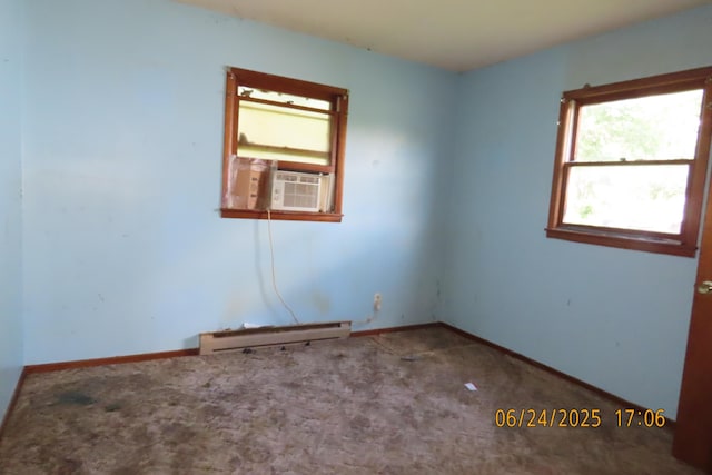 321 W Cofield St, Aurora, MO 65605 - unfurnished room featuring baseboard heating, cooling unit, and carpet floors