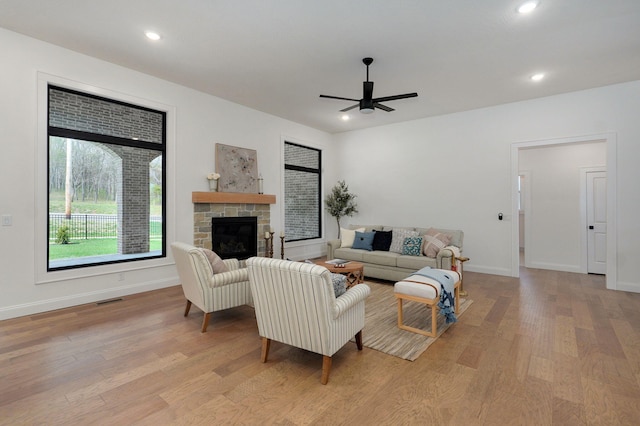3945 E Woodhue St, Springfield, MO 65802 - living room with ceiling fan, wood finished floors, a fireplace, and recessed lighting