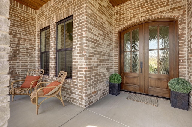 3945 E Woodhue St, Springfield, MO 65802 - view of exterior entry featuring brick siding and french doors