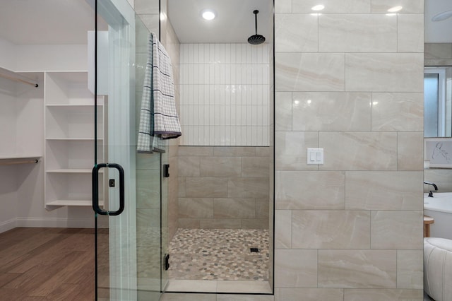 3945 E Woodhue St, Springfield, MO 65802 - full bathroom with a shower stall and wood finished floors