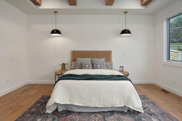 3945 E Woodhue St, Springfield, MO 65802 - bedroom featuring wood finished floors and beam ceiling