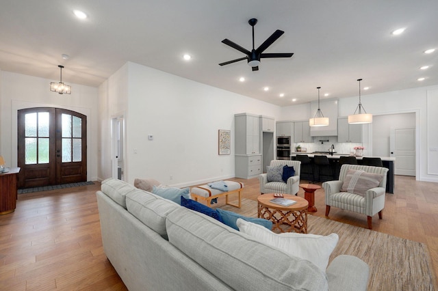 3945 E Woodhue St, Springfield, MO 65802 - living area with french doors, light wood-style floors, recessed lighting, a ceiling fan, and a chandelier