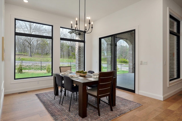 3945 E Woodhue St, Springfield, MO 65802 - dining room featuring a chandelier, light wood finished floors, and recessed lighting