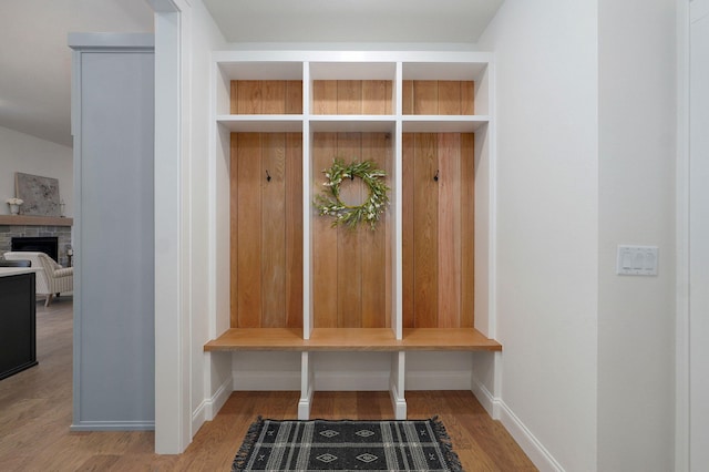 3945 E Woodhue St, Springfield, MO 65802 - mudroom featuring wood finished floors and a fireplace
