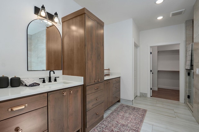 3945 E Woodhue St, Springfield, MO 65802 - full bath with vanity, a stall shower, a spacious closet, and recessed lighting