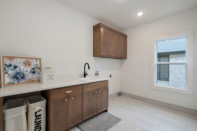 3945 E Woodhue St, Springfield, MO 65802 - laundry area with hookup for an electric dryer, hookup for a washing machine, and cabinet space