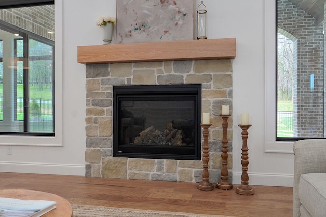 3945 E Woodhue St, Springfield, MO 65802 - detailed view of wood finished floors and a stone fireplace