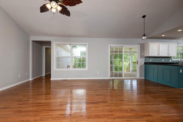 805 S Benson Pl, Nixa, MO 65714 - unfurnished living room with vaulted ceiling, a ceiling fan, light wood finished floors, and recessed lighting