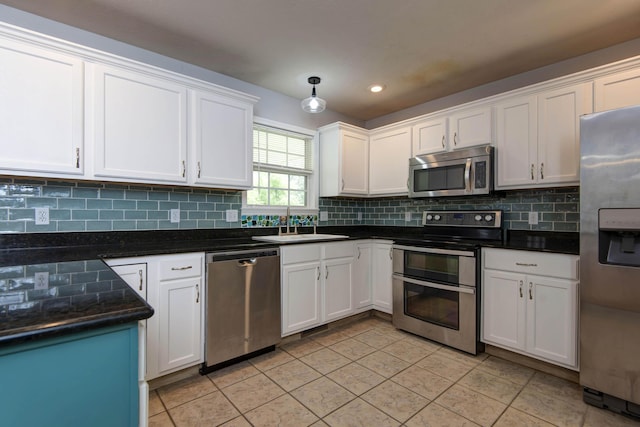 805 S Benson Pl, Nixa, MO 65714 - kitchen featuring stainless steel appliances, white cabinets, tasteful backsplash, and recessed lighting
