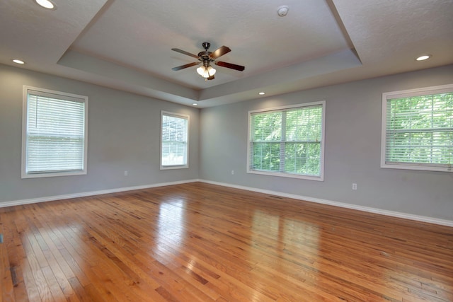 805 S Benson Pl, Nixa, MO 65714 - unfurnished room with a raised ceiling, light wood finished floors, ceiling fan, a smoke detector, and recessed lighting