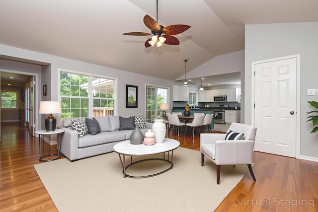 805 S Benson Pl, Nixa, MO 65714 - living room with vaulted ceiling, a ceiling fan, and light wood-type flooring