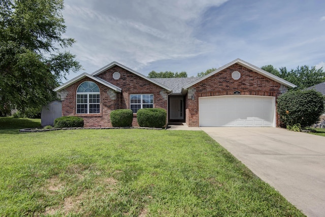 805 S Benson Pl, Nixa, MO 65714 - single story home with brick siding, an attached garage, driveway, and a front yard