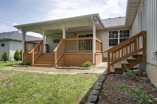 805 S Benson Pl, Nixa, MO 65714 - rear view of property with stairway, covered porch, roof with shingles, and a lawn