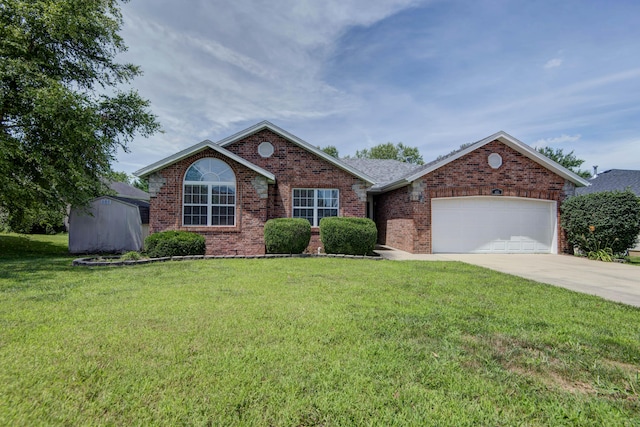 805 S Benson Pl, Nixa, MO 65714 - ranch-style house with brick siding, a garage, a front lawn, concrete driveway, and a shed