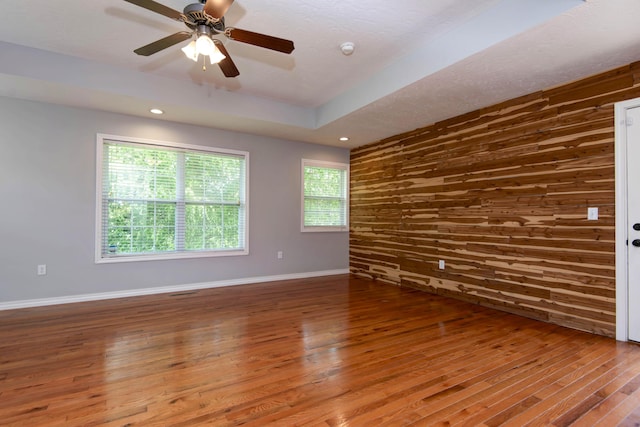 805 S Benson Pl, Nixa, MO 65714 - unfurnished room featuring wood finished floors, wood walls, a ceiling fan, recessed lighting, and a smoke detector