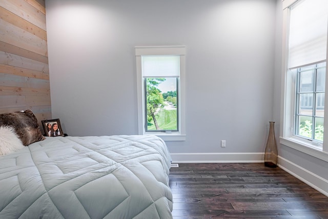 6323 Creeksedge Ct, Ozark, MO 65721 - bedroom with dark wood-style flooring and wooden walls