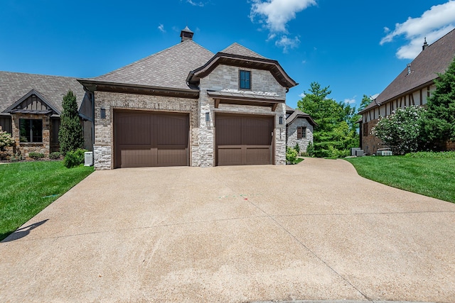 6323 Creeksedge Ct, Ozark, MO 65721 - french country home featuring stone siding, concrete driveway, and a front yard