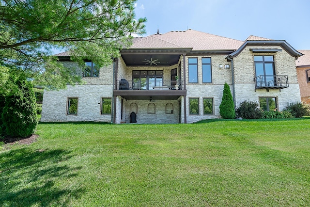 6323 Creeksedge Ct, Ozark, MO 65721 - rear view of property with a balcony, ceiling fan, a lawn, stone siding, and brick siding
