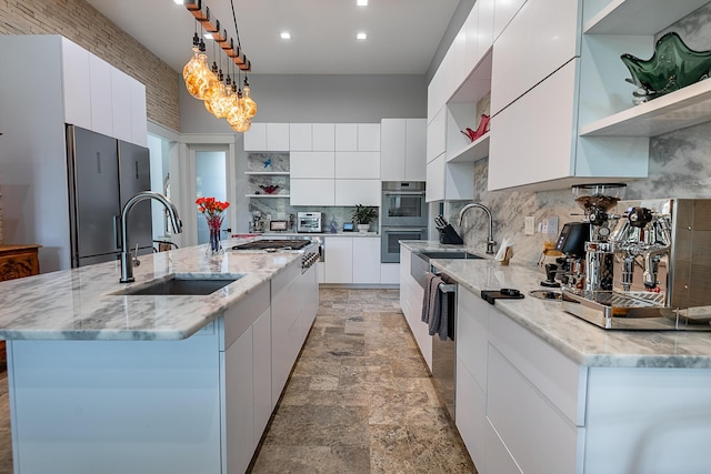 6323 Creeksedge Ct, Ozark, MO 65721 - kitchen with open shelves, modern cabinets, stainless steel appliances, white cabinetry, and decorative backsplash