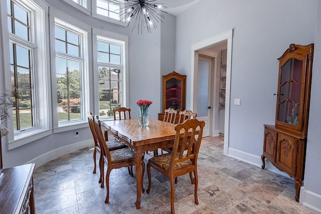 6323 Creeksedge Ct, Ozark, MO 65721 - dining space with a chandelier and stone finish flooring