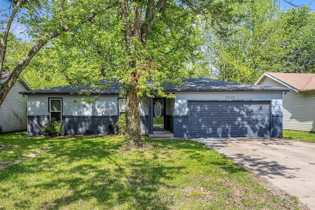 2515 S Newton Ave, Springfield, MO 65807 - ranch-style home featuring brick siding, concrete driveway, a garage, and a front yard