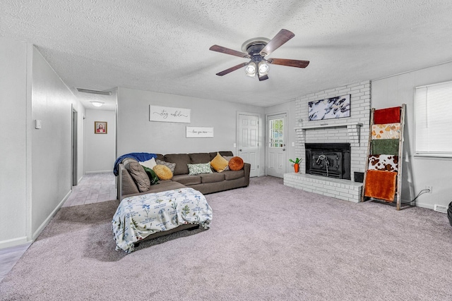 2515 S Newton Ave, Springfield, MO 65807 - living area with a textured ceiling, ceiling fan, carpet flooring, and a fireplace