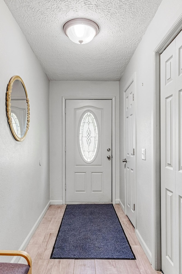 2515 S Newton Ave, Springfield, MO 65807 - entrance foyer featuring a textured ceiling and light wood finished floors