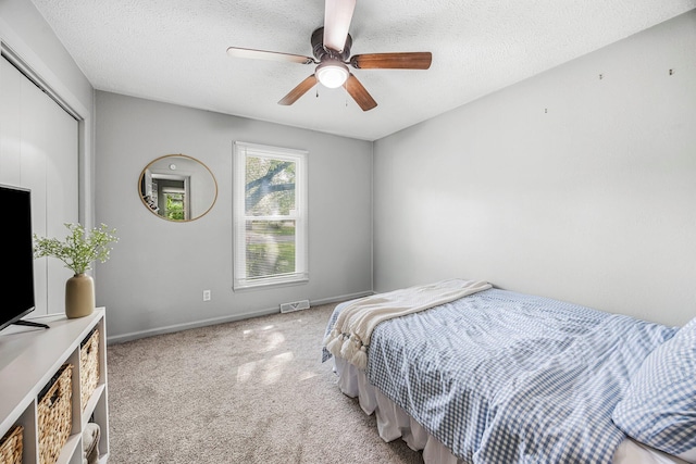 2515 S Newton Ave, Springfield, MO 65807 - carpeted bedroom with a textured ceiling, a ceiling fan, and a closet