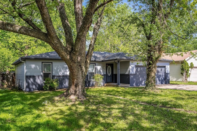 2515 S Newton Ave, Springfield, MO 65807 - single story home with an attached garage, concrete driveway, brick siding, and a front yard