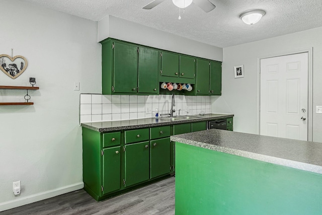 2515 S Newton Ave, Springfield, MO 65807 - kitchen with green cabinets, wood finished floors, tasteful backsplash, a textured ceiling, and a ceiling fan