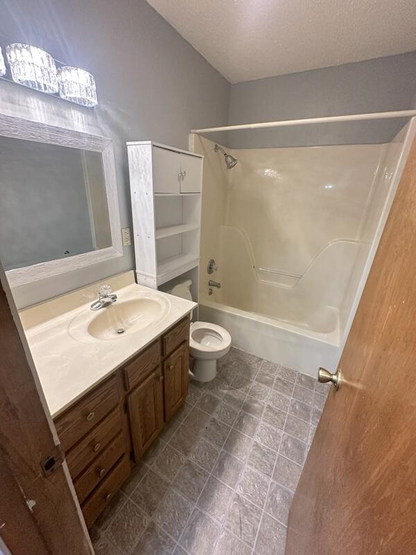 2201 S 18th Ave, Ozark, MO 65721 - full bathroom with vanity and shower / washtub combination