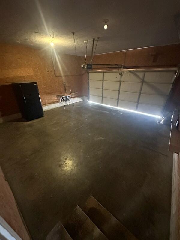 2201 S 18th Ave, Ozark, MO 65721 - garage featuring a garage door opener
